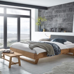 Bettgestell aus Holz mit Polsterkopfteil
